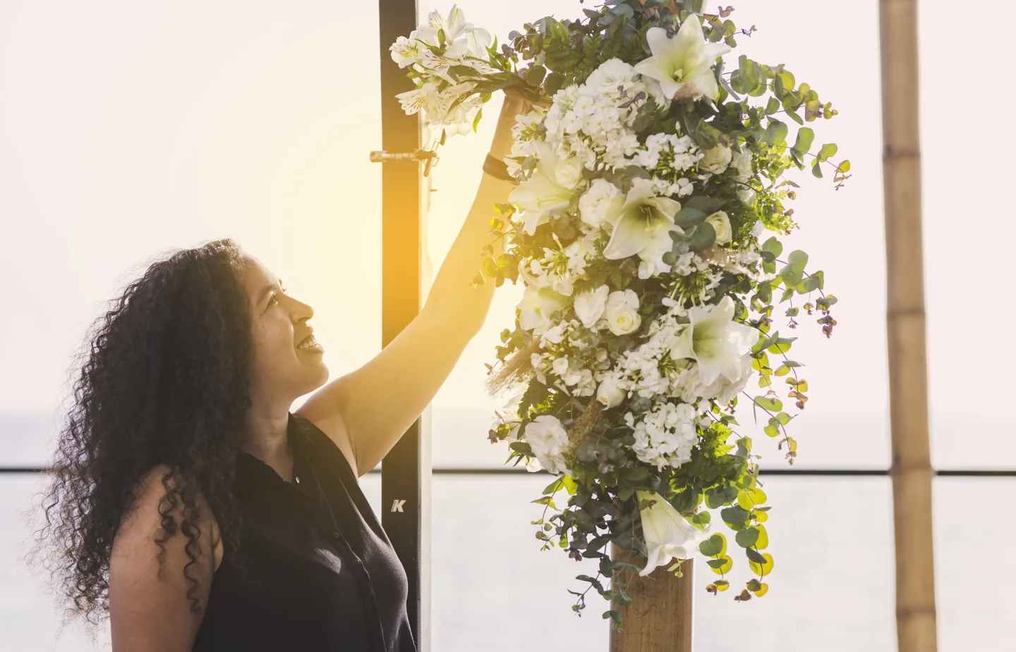 Sivan arranging white flowers