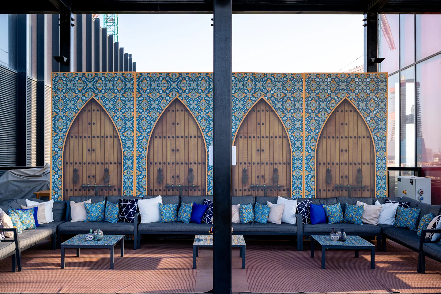 Blue lounge seating with a patterned backdrop